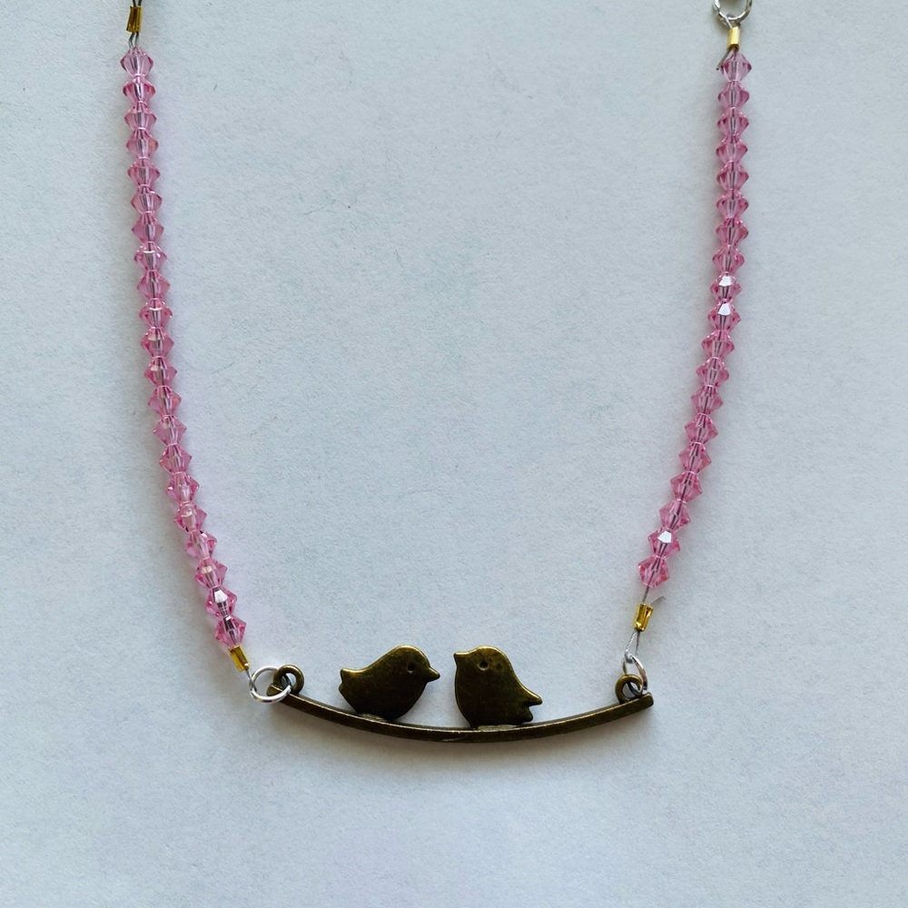 Pink crystal beaded necklace with birds charm